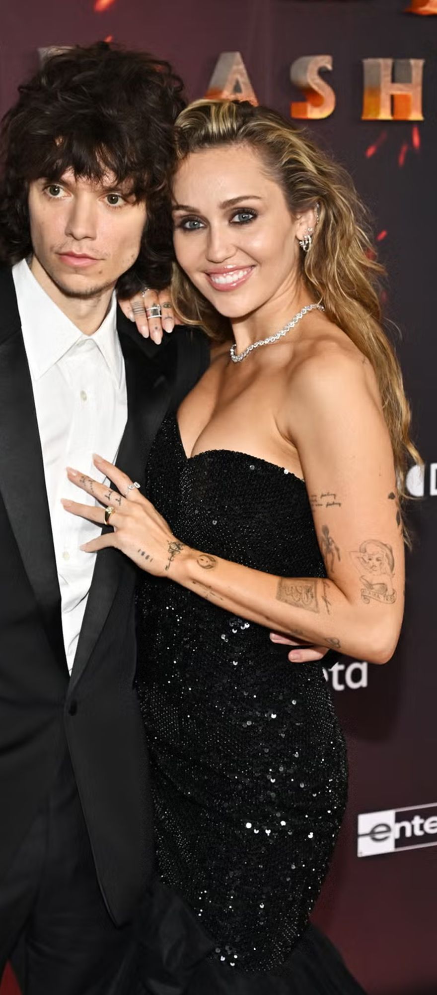 Miley Cyrus is engaged to Maxx Morando. It was confirmed as they stood at the premier of Avatar: Fire and Ash, as Miley flashed a huge gold ring on her engagement finger. 