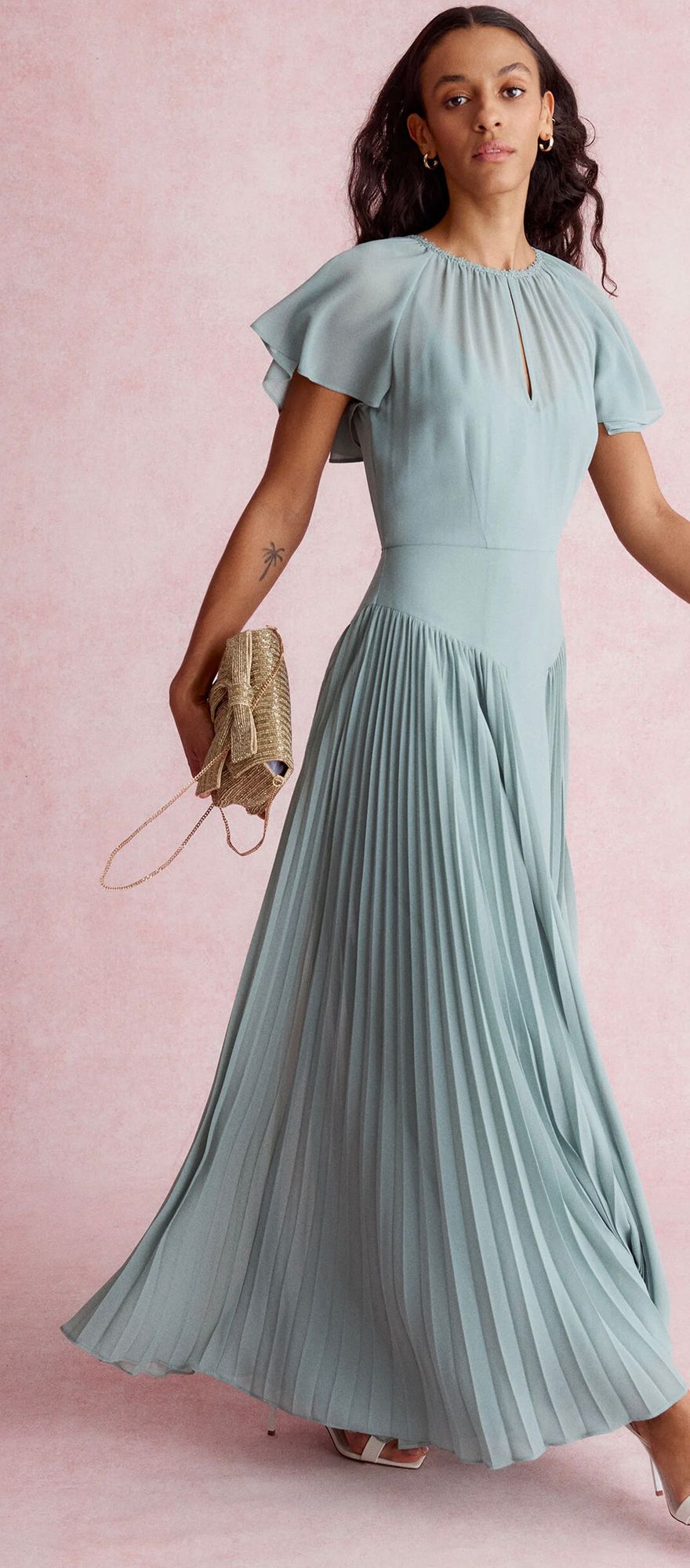 Sage green spring bridesmaid dress with pleated skirt and flutter sleeves