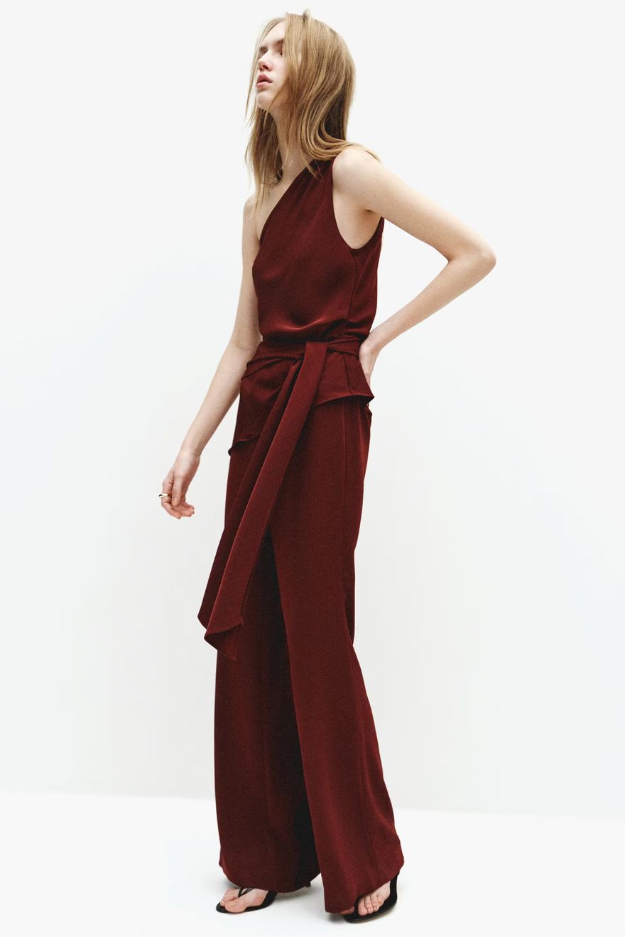 Mango asymmetrical jumpsuit casual wedding guest attire in maroon with bow