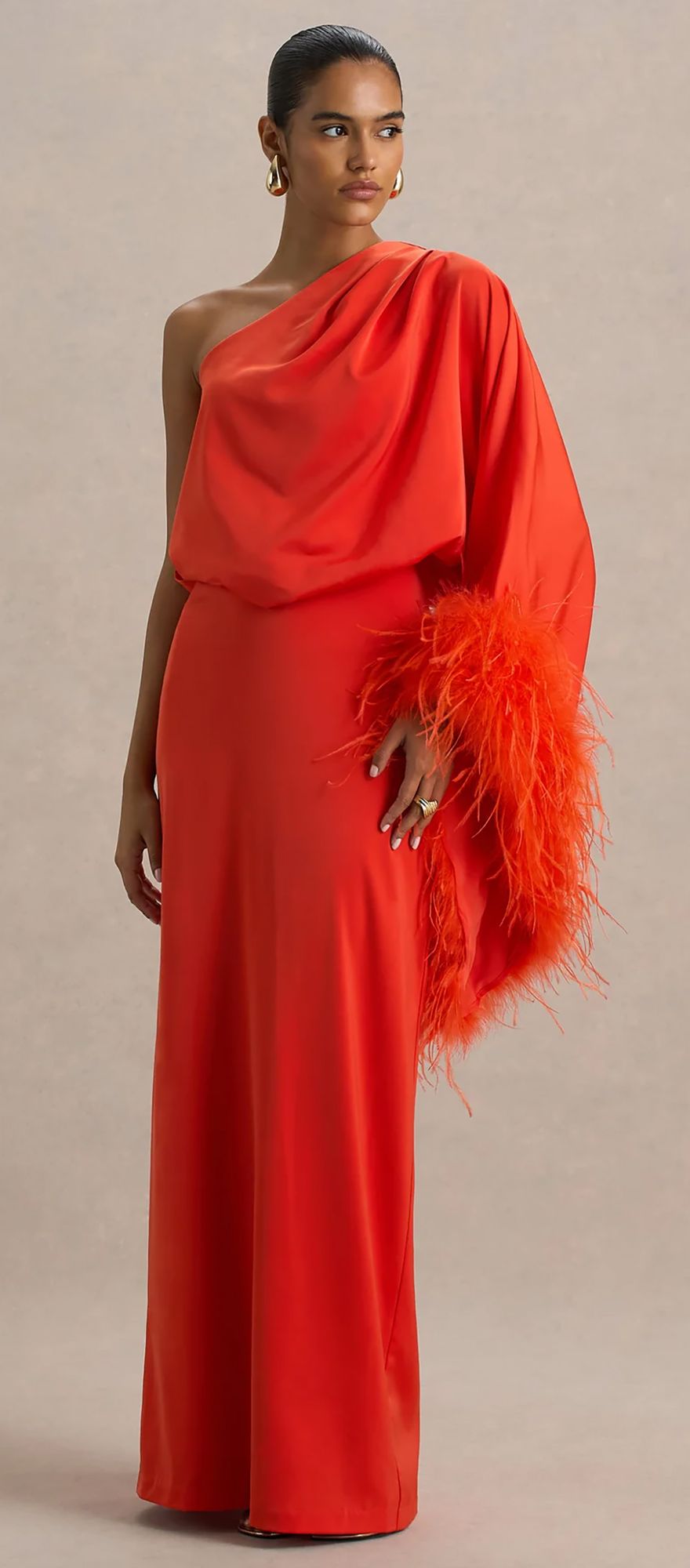 Bright orange satin spring bridesmaid dress with long sleeves and feather detailing