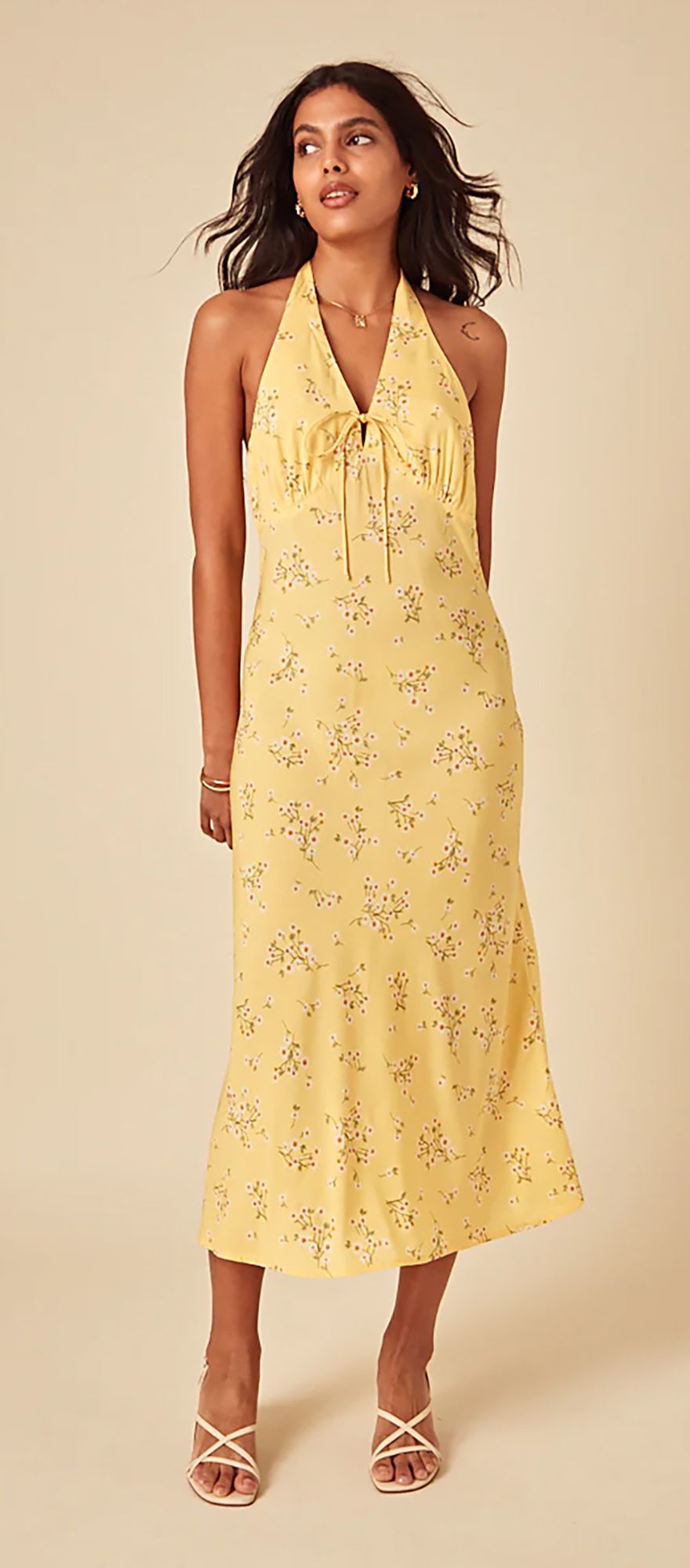 butter yellow halter wedding guest dress with floral print