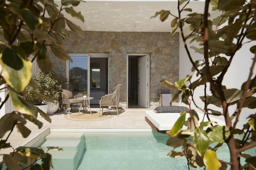 Private suite at Once in Mykonos featuring a shaded patio with outdoor seating and private pool