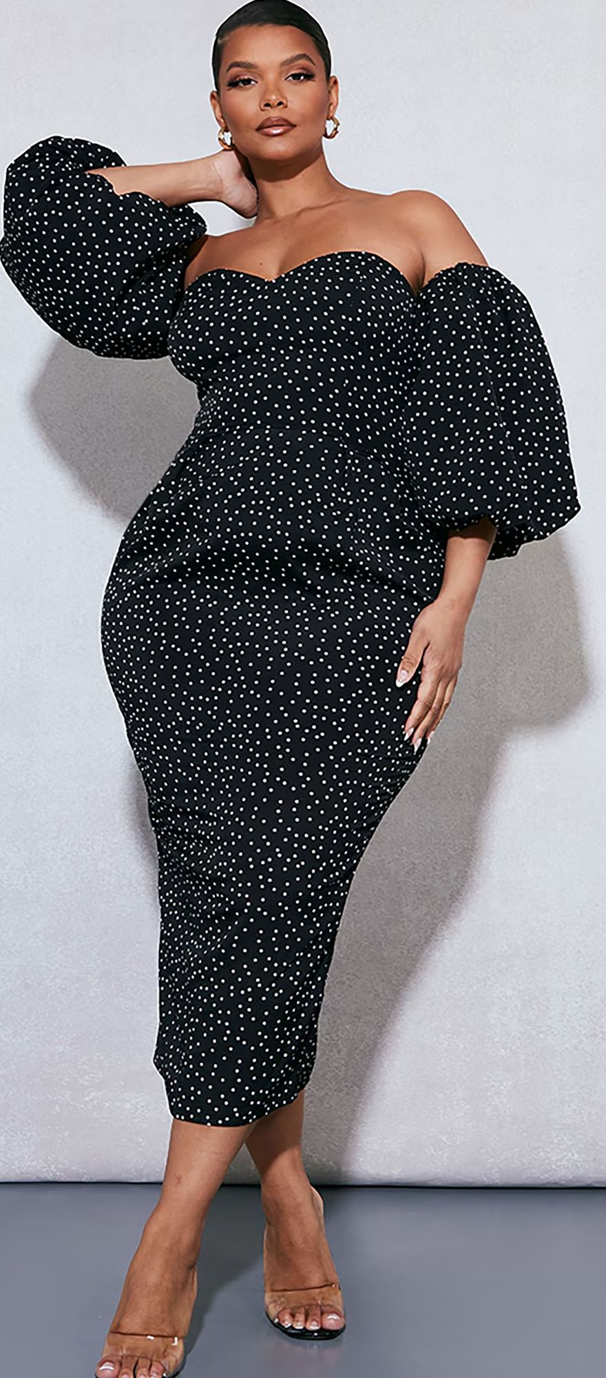 Black plus size polka dot wedding guest dress from plt with puff sleeves