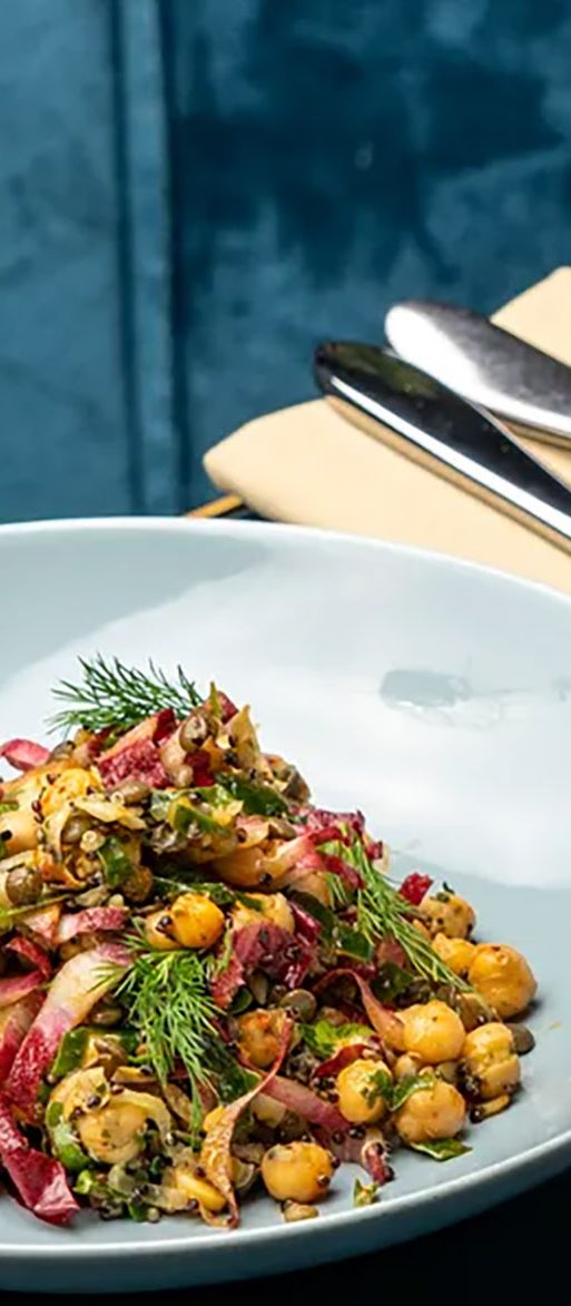 Upscale Indian bottomless brunch dishes and wine on table in Chelsea