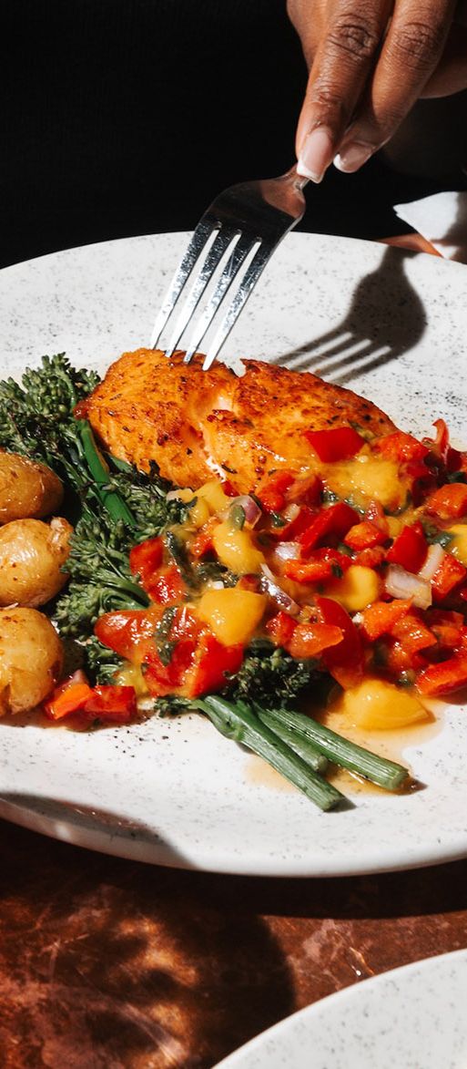 Plate of food and cocktail at The Blues Kitchen bottomless brunch 