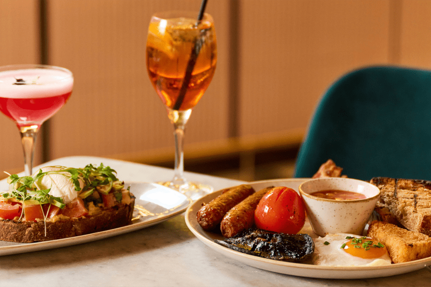 Classic brunch plates and cocktails, including full english breakfast and aperol spritz at the The Foundry Project Manchester