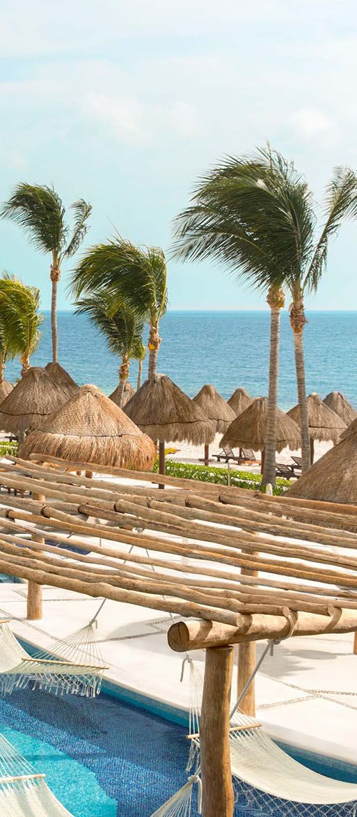 Outdoor pool area with sea view at Excellence Playa Mujeres, Cancun Mexico honeymoon destination