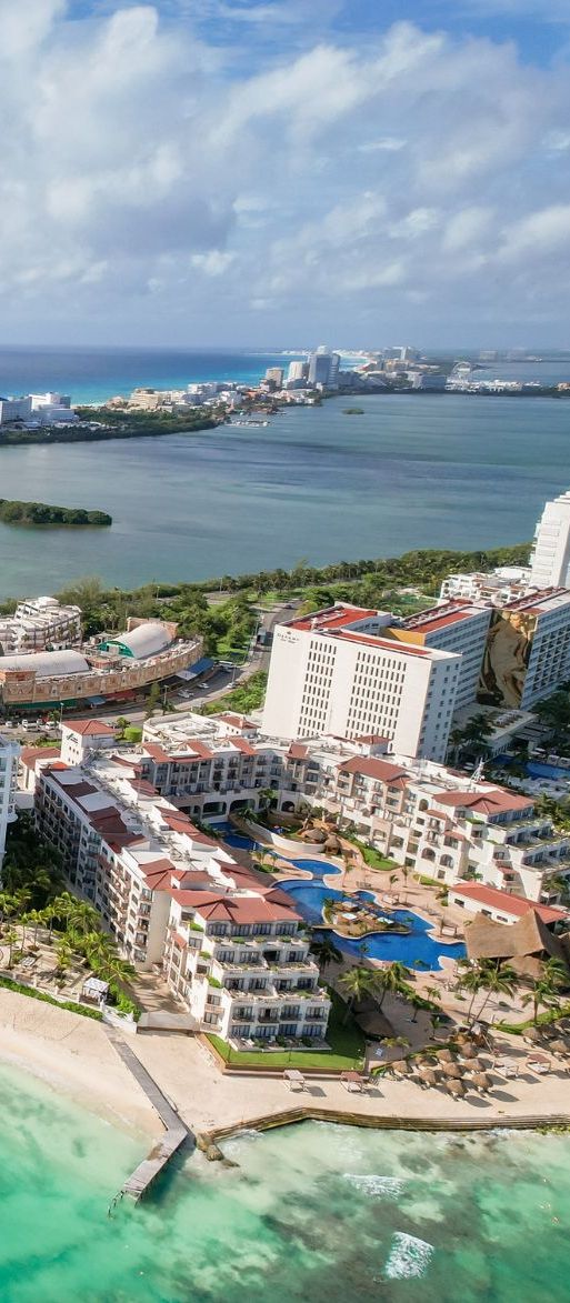 Winding Cancun coastline with beaches and highrise buildings for Mexico honeymoon