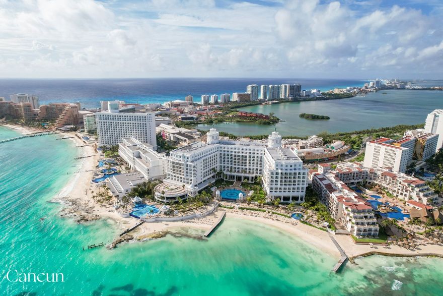 Winding Cancun coastline with beaches and highrise buildings for Mexico honeymoon