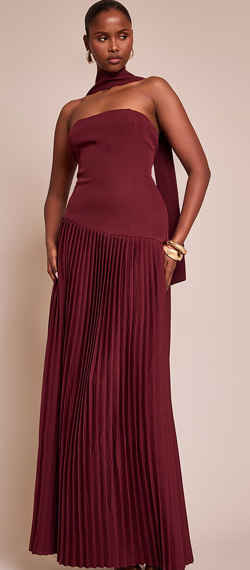 PLT wine coloured wedding guest dress with bandeau neckline and pleated skirt 