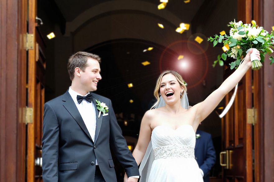 Happy married couple leaving the church after getting married