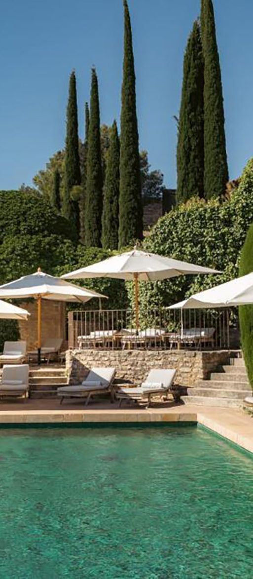 Pool area of luxury hotel in restored village in Provence for minimoon