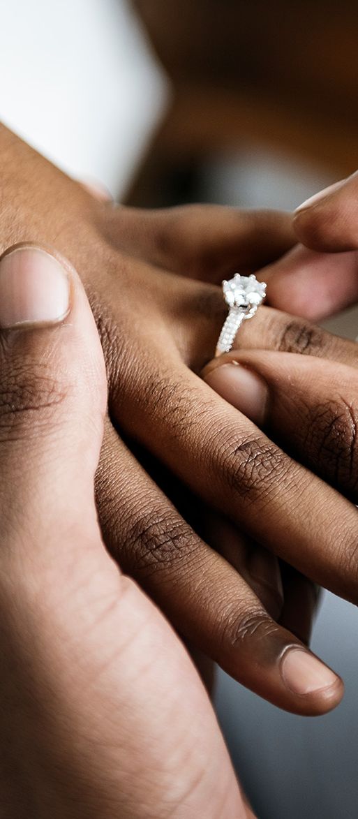 proposal-as-man-slides-ring-onto-finger