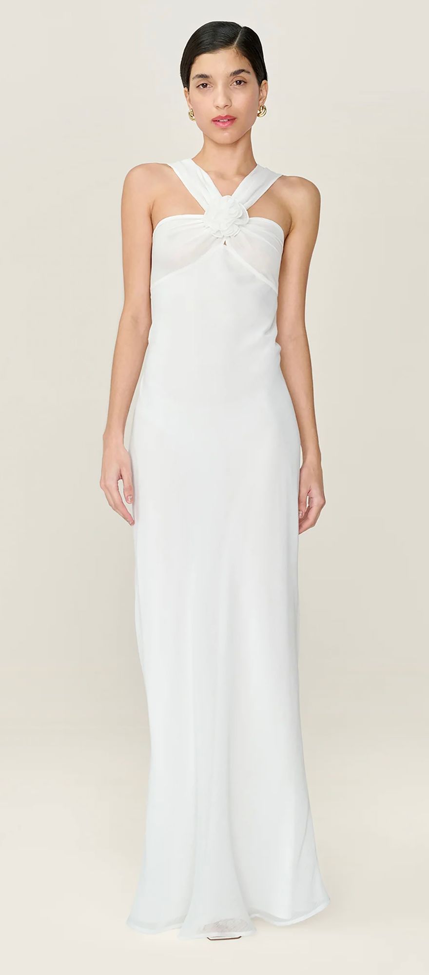 Spring wedding dress with high neckline and sculptural rosette detail