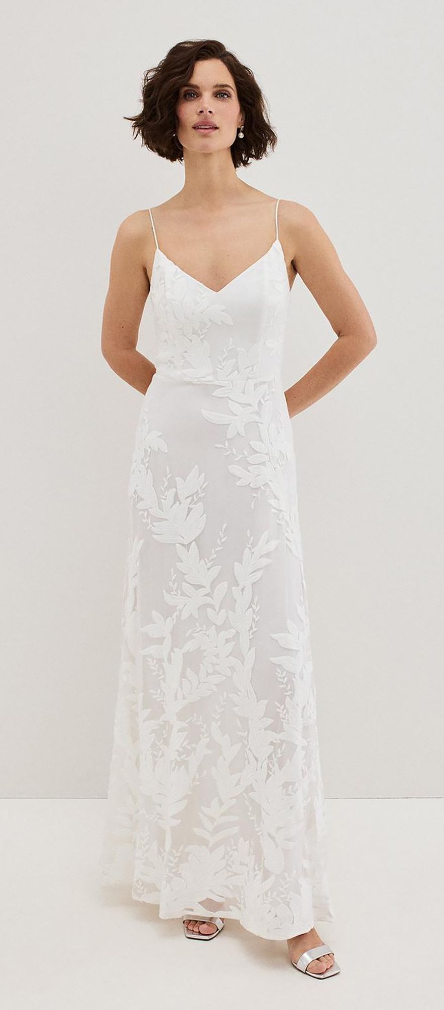 Silk ivory spring wedding dress with embroidered floral detailing