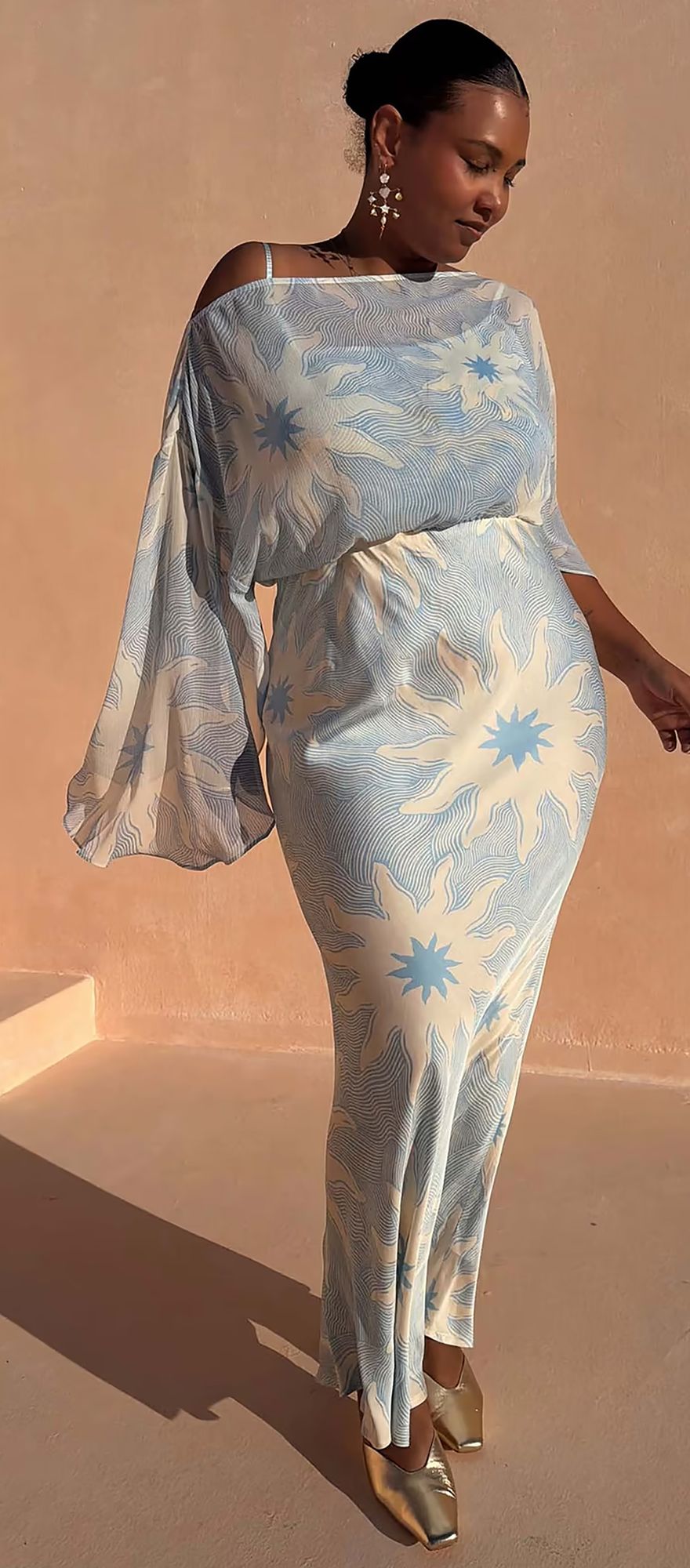 Never Fully Dressed blue destination wedding guest dress with sun motifs