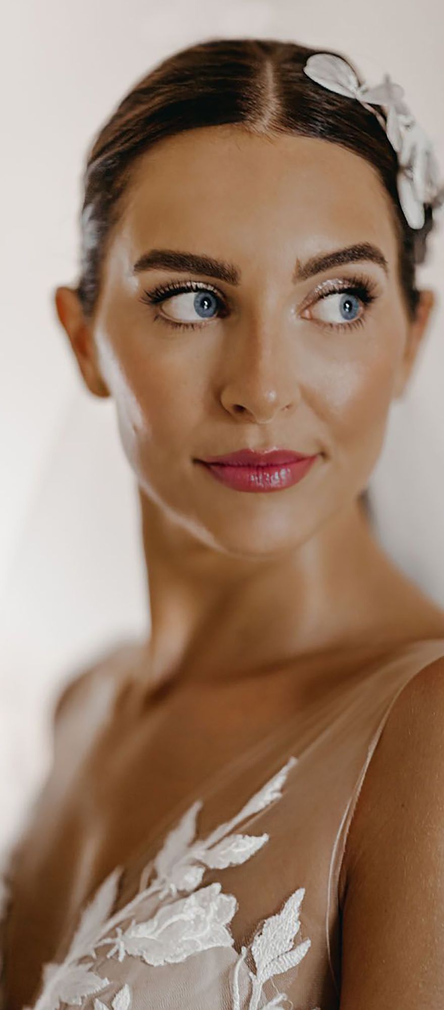 Bride with a pink lip, glittery eyeshadow and glowing skin