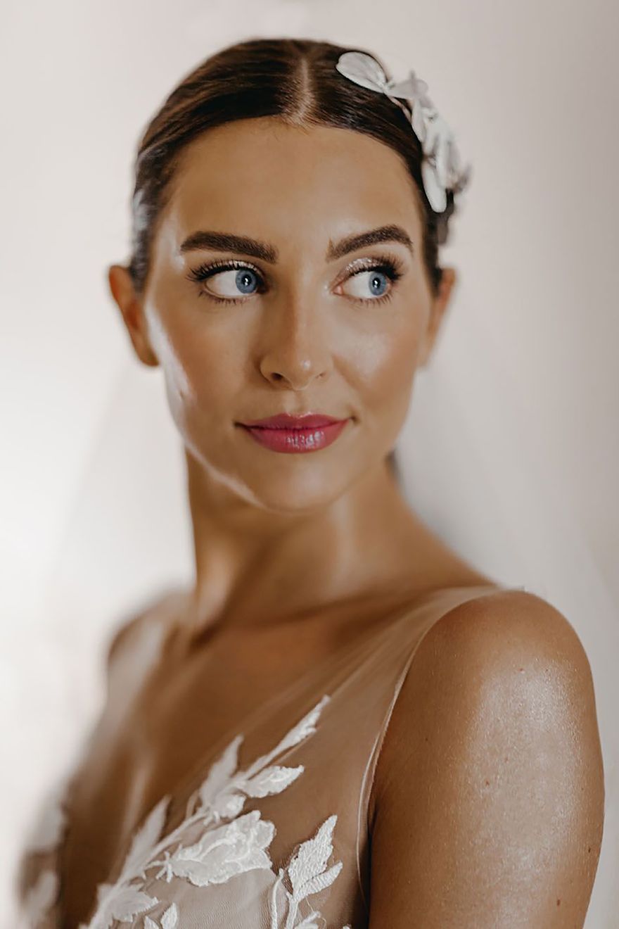 Bride with a pink lip, glittery eyeshadow and glowing skin