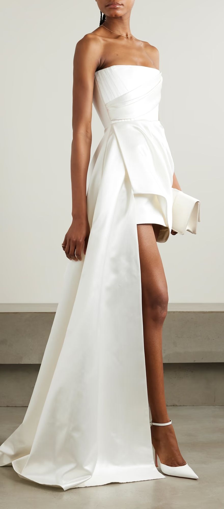 Woman wearing the Alex Perry Blair asymmetric draped gown, featuring a one-shoulder neckline, elegant draped detailing, and a floor-length column silhouette.
