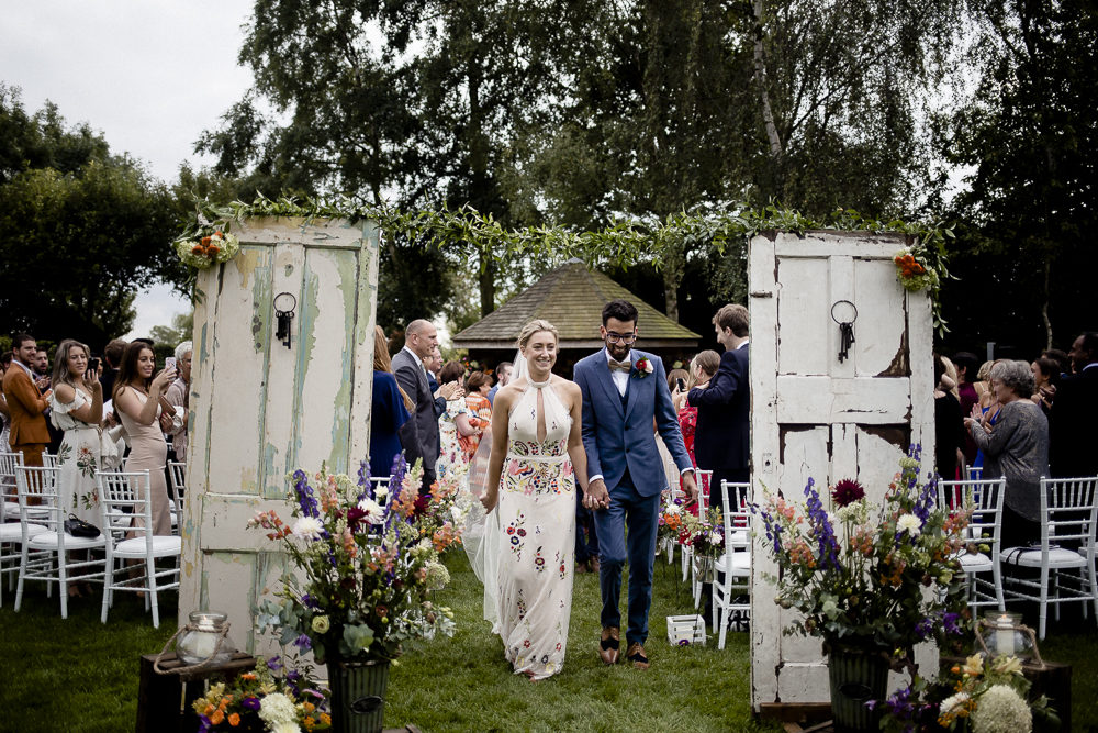 Red Bridesmaids Dresses Floral Wedding Gown Outdoor Ceremony